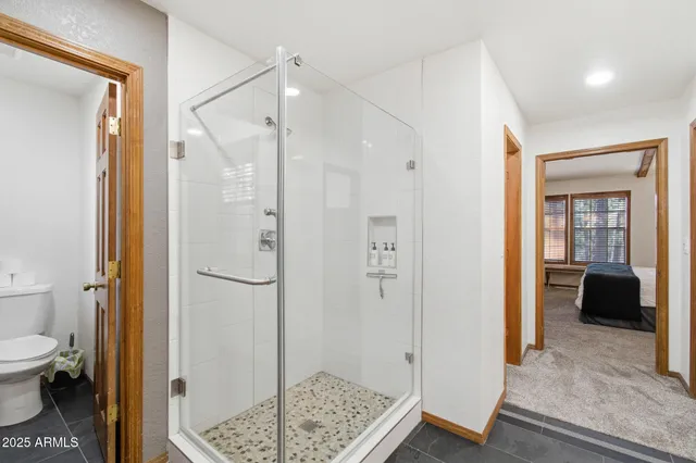 a dining room with furniture a chandelier and wooden floor