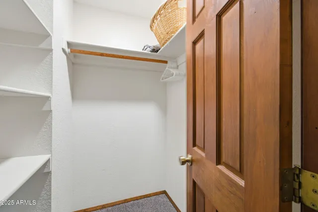 a kitchen with a refrigerator and a sink