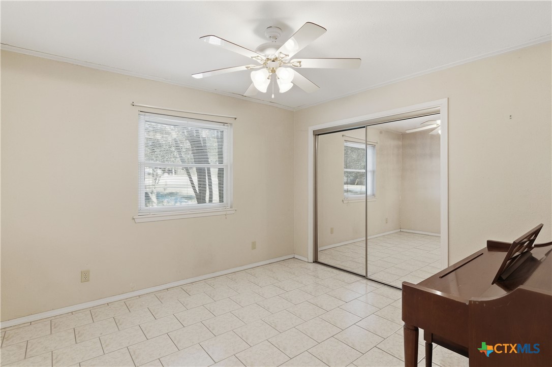 151 Hillside Street Seguin, TX 78155 - Photo 14 of 33 a view of an empty room with a window
