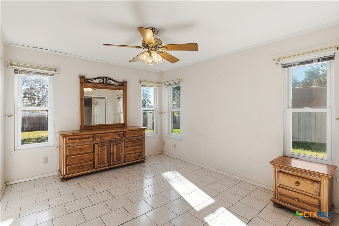 151 Hillside Street Seguin, TX 78155 - Photo 17 of 33 a room with chandelier and wooden floors