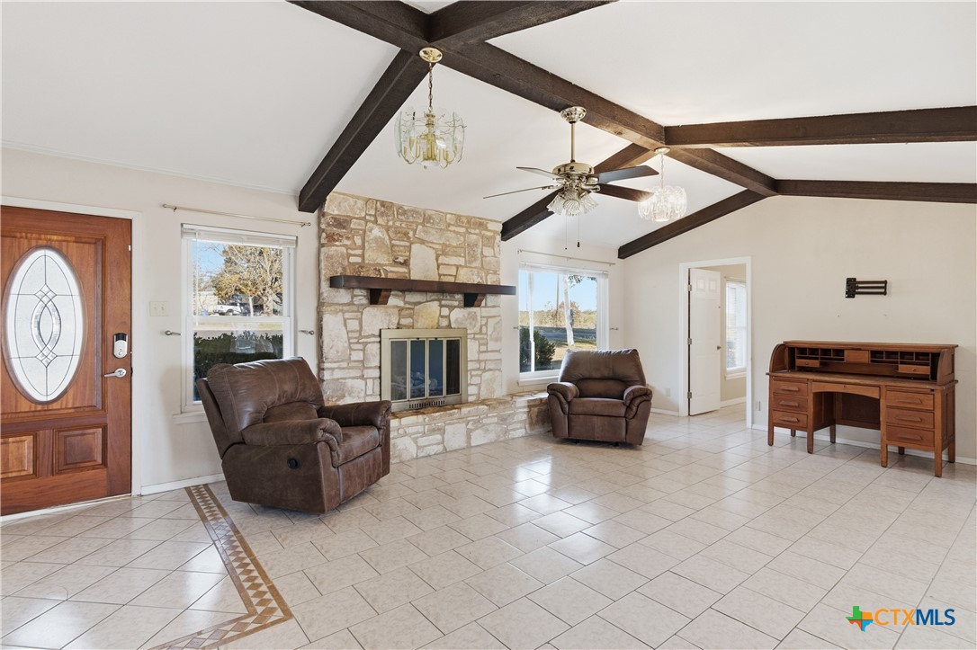 151 Hillside Street Seguin, TX 78155 - Photo 2 of 33 a living room with furniture a fireplace and a flat screen tv