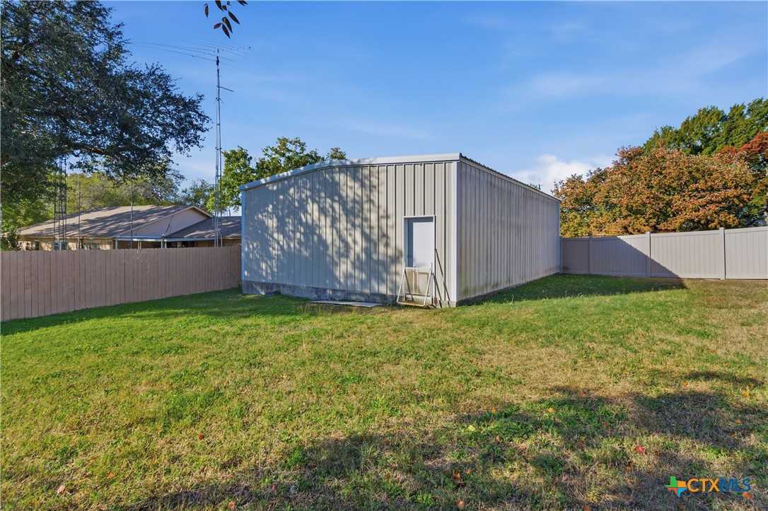 151 Hillside Street Seguin, TX 78155 - Photo 31 of 33 a view of a backyard with potted plants and large tree