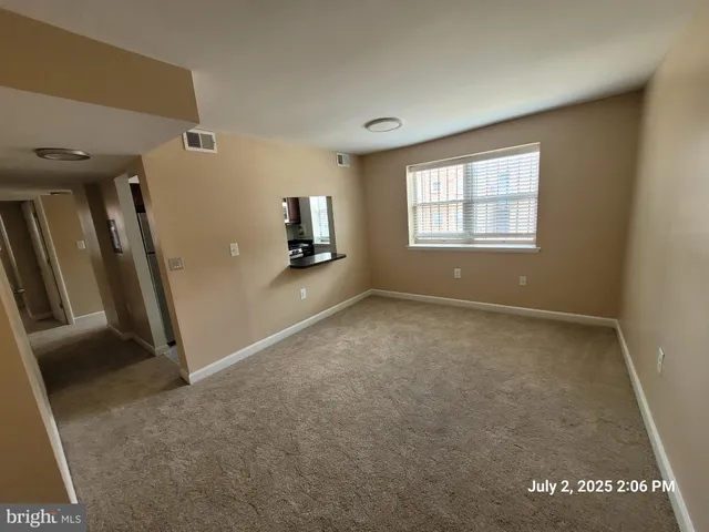 a view of an empty room with a window