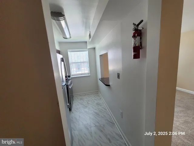 a view of a hallway with windows