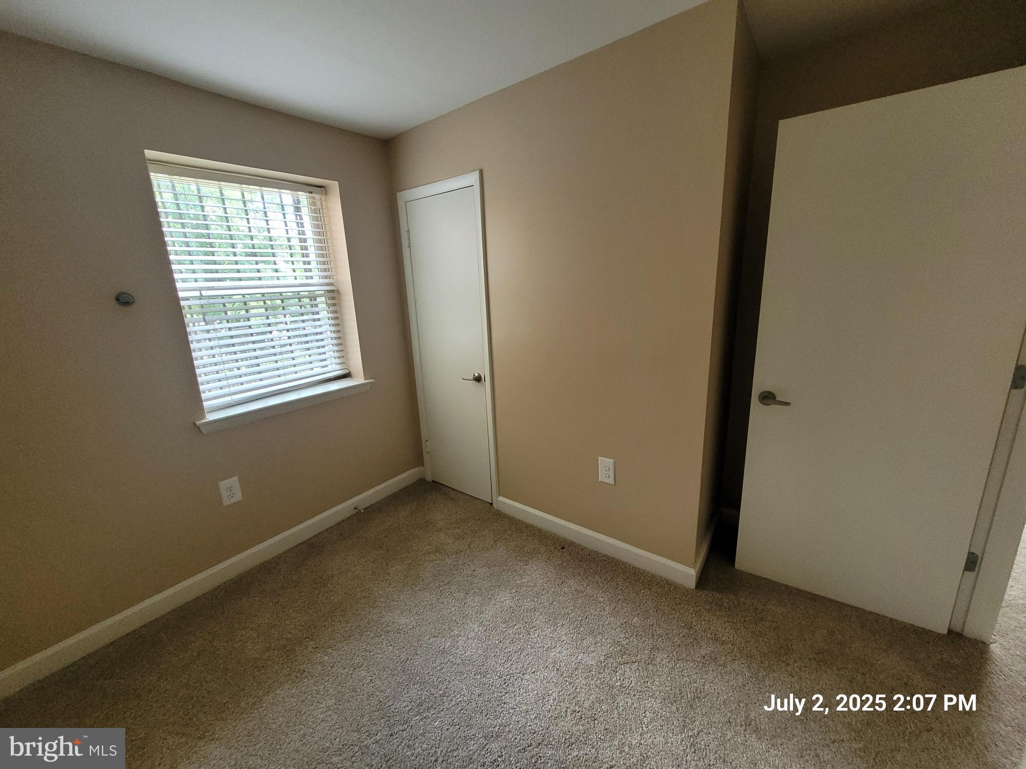 2644 Birney Place Southeast, Unit 102 Washington, DC 20020 - Photo 22 of 36 a view of an empty room with a window