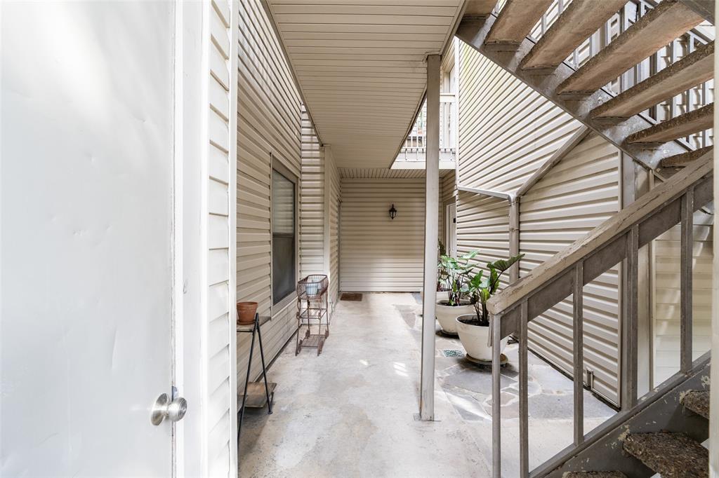 7340 Skillman Street, Unit 1113 Dallas, TX 75231 - Photo 20 of 31 Garage Entry conveniently located at the base of the stairs, directly below condo!
