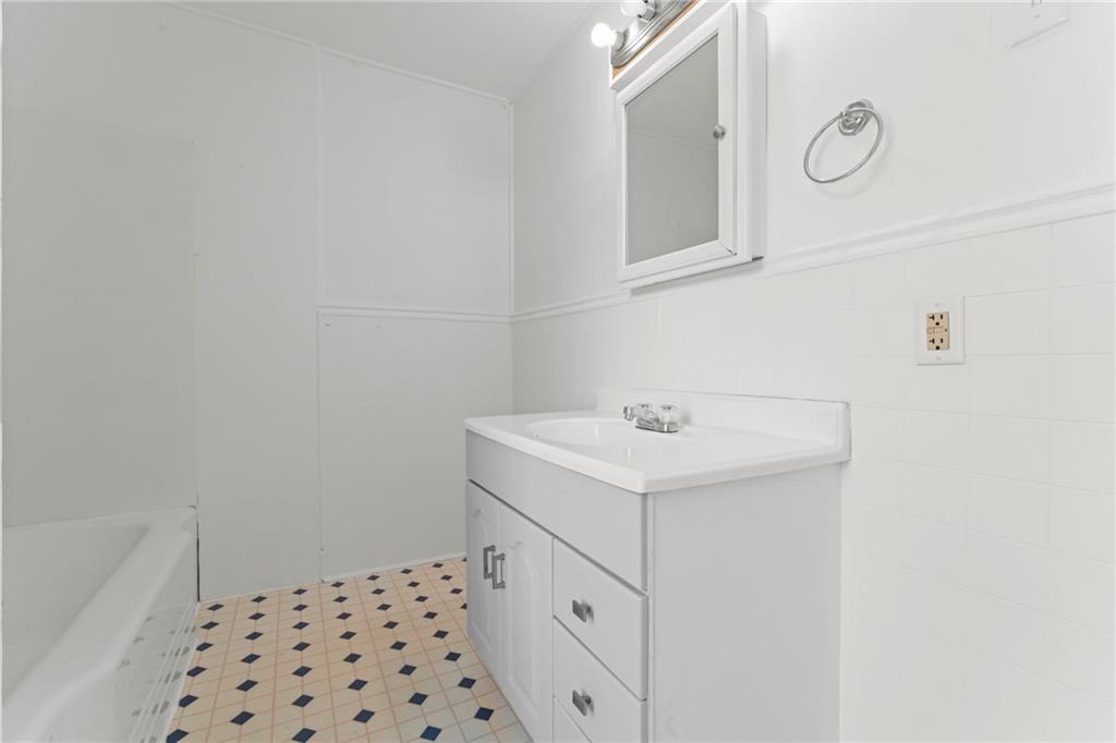 11 Knox Avenue Monessen, PA 15062 - Photo 20 of 25 a bathroom with a sink a toilet and a mirror