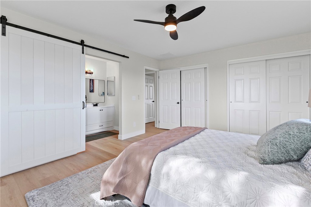 5658 Prancing Deer Road Paso Robles, CA 93446 - Photo 13 of 31 a spacious bedroom with a bed and a shower