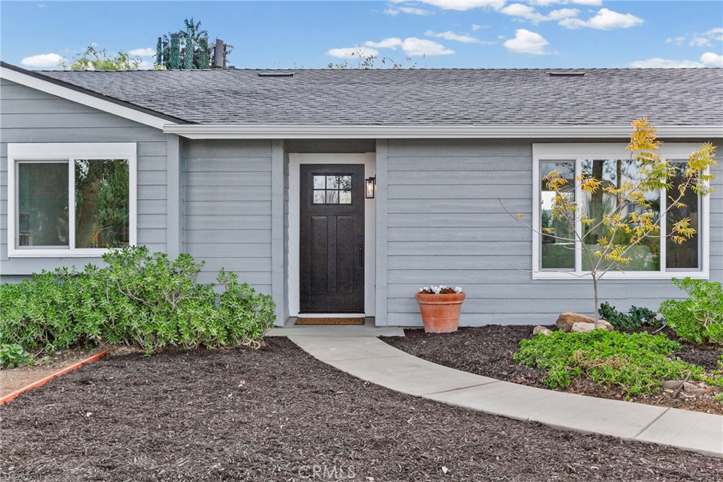 5658 Prancing Deer Road Paso Robles, CA 93446 - Photo 3 of 31 a front view of a house with outdoor seating
