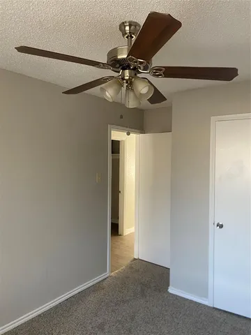 a view of a chandelier fan in a room