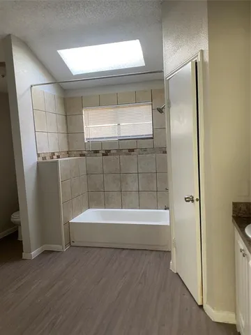 a bathroom with a bathtub and a shower