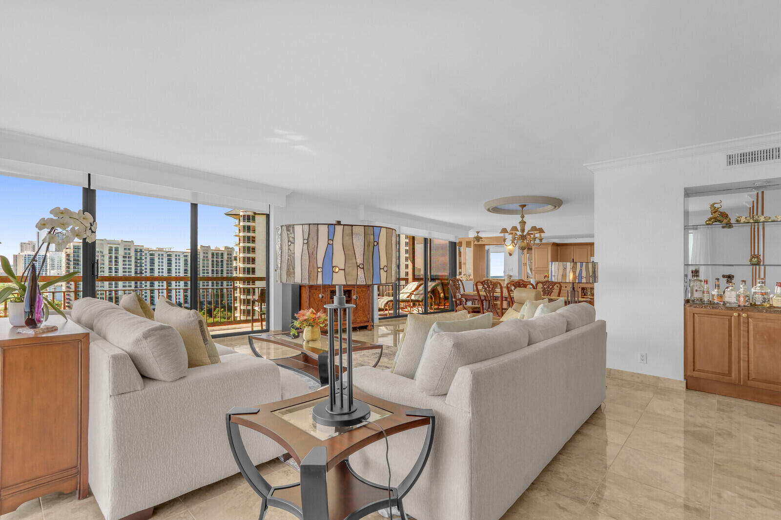 4000 North Ocean Drive, Unit 1702 Singer Island, FL 33404 - Photo 12 of 48 a living room with furniture and a table