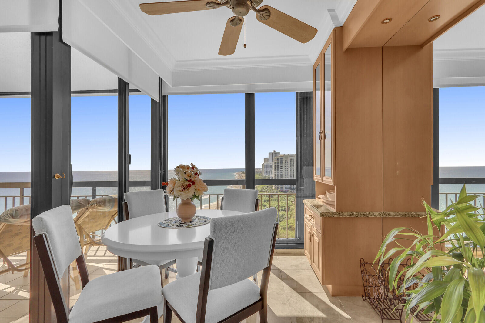 4000 North Ocean Drive, Unit 1702 Singer Island, FL 33404 - Photo 16 of 48 a dining room with furniture a large window and garden view