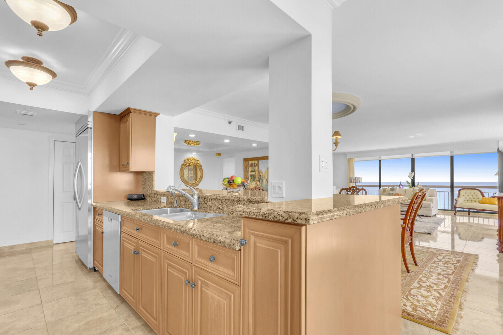 4000 North Ocean Drive, Unit 1702 Singer Island, FL 33404 - Photo 17 of 48 a kitchen with stainless steel appliances granite countertop a sink and cabinets