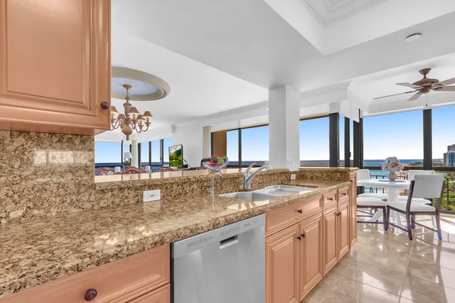 a bedroom with a large bed and a flat tv screen on dresser