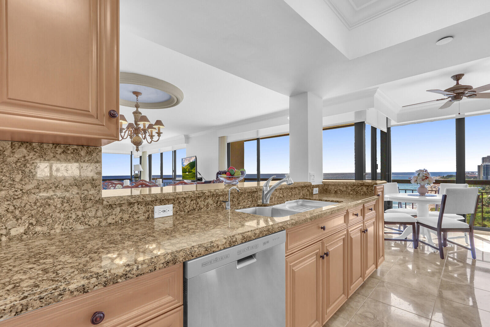 4000 North Ocean Drive, Unit 1702 Singer Island, FL 33404 - Photo 19 of 48 a kitchen with stainless steel appliances granite countertop a sink and a refrigerator