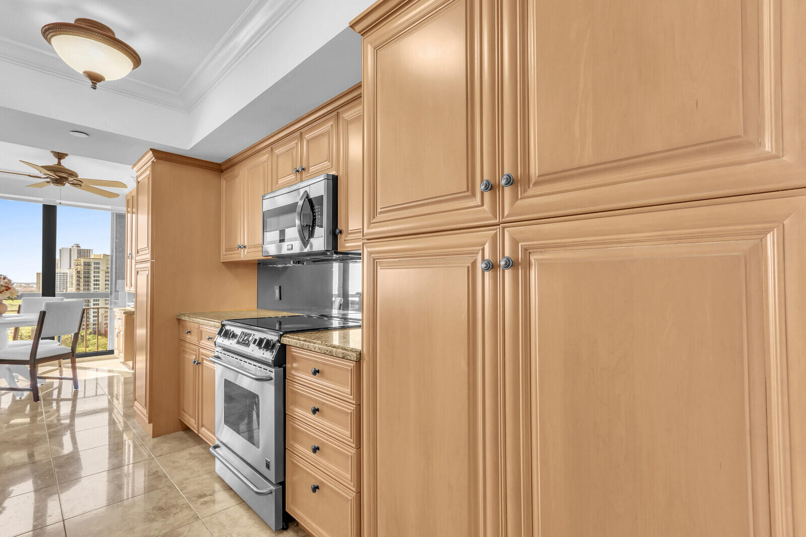 4000 North Ocean Drive, Unit 1702 Singer Island, FL 33404 - Photo 20 of 48 a kitchen with stainless steel appliances granite countertop a stove a sink and a refrigerator