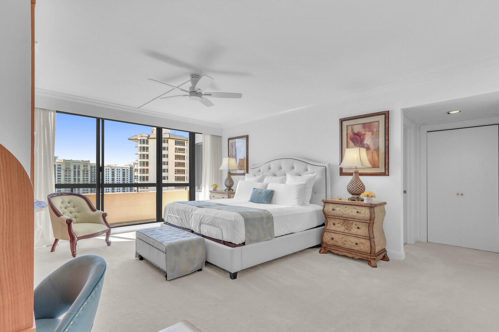 4000 North Ocean Drive, Unit 1702 Singer Island, FL 33404 - Photo 22 of 48 a spacious bedroom with a bed and glass walk in closet