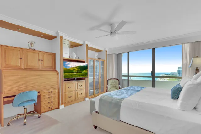 a bathroom with a sink a large mirror and a shower