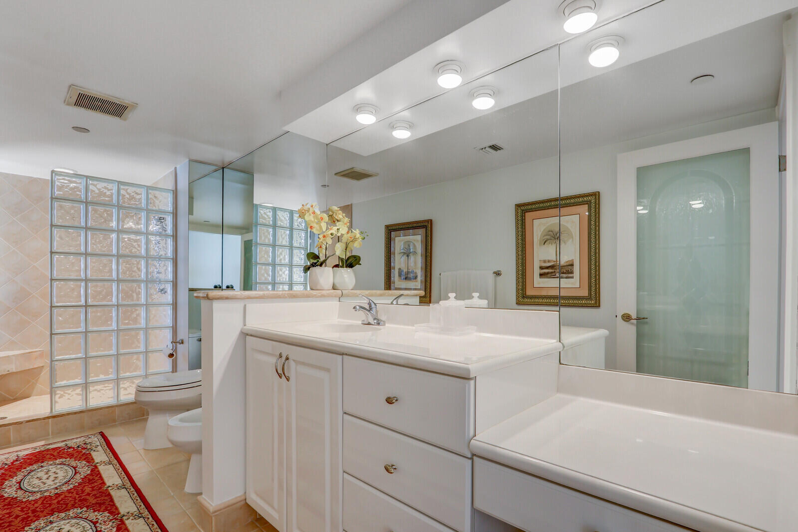 4000 North Ocean Drive, Unit 1702 Singer Island, FL 33404 - Photo 31 of 48 a bathroom with a sink a large mirror and a shower