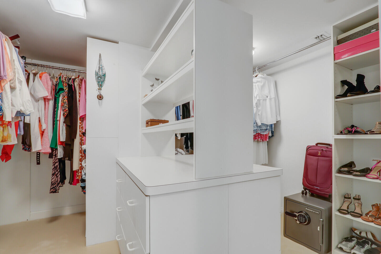 4000 North Ocean Drive, Unit 1702 Singer Island, FL 33404 - Photo 32 of 48 a view of walk in closet with clothes and shoes