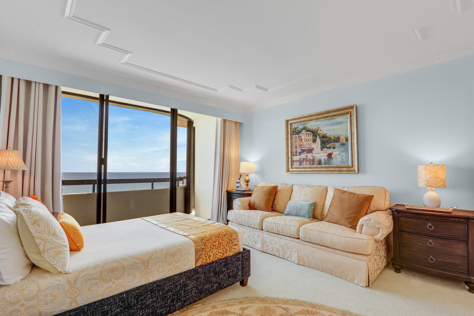 4000 North Ocean Drive, Unit 1702 Singer Island, FL 33404 - Photo 35 of 48 a bedroom with a large bed and a couch