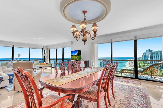 a view of a dining room with furniture wooden floor and chandelier