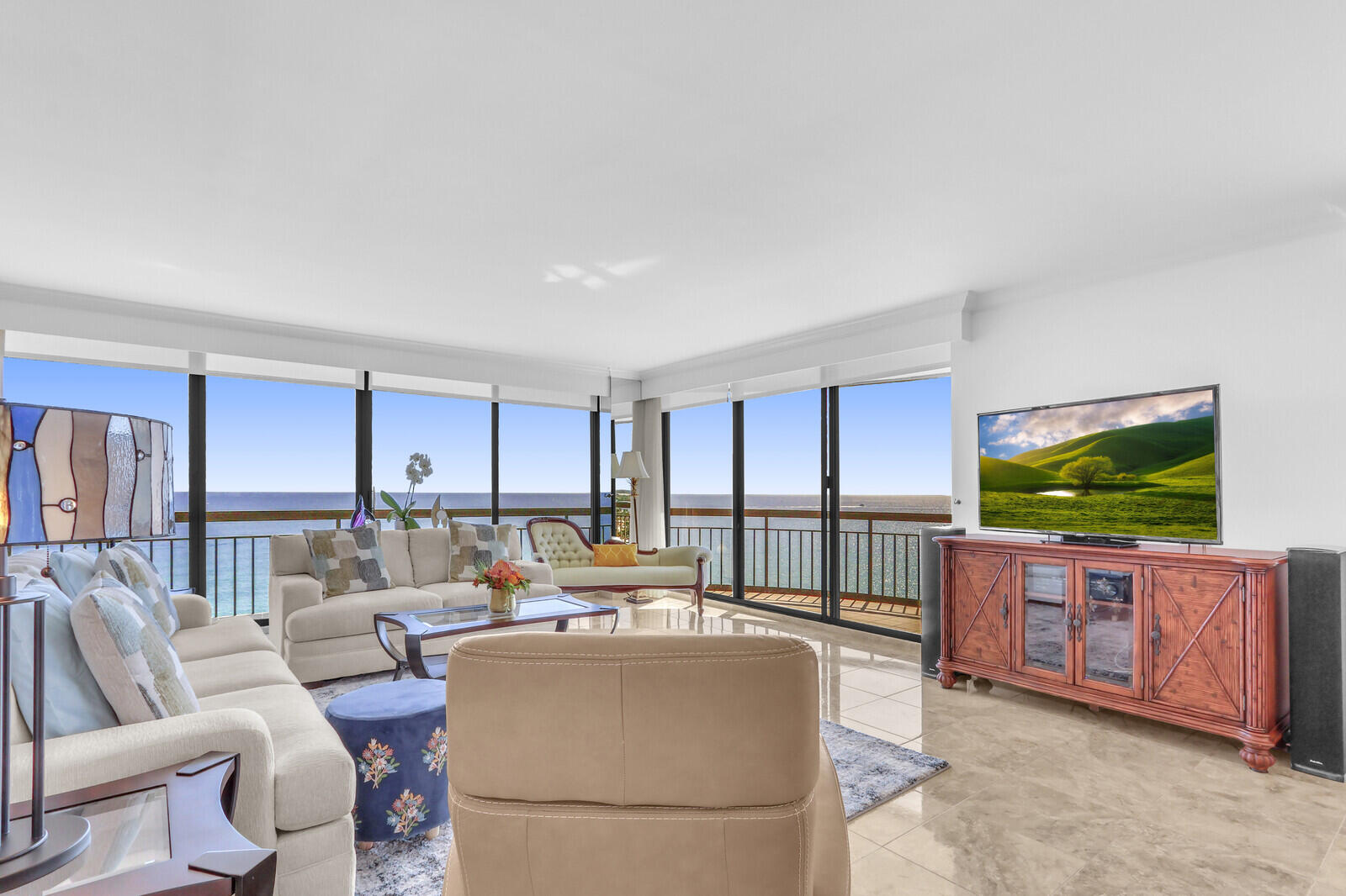 4000 North Ocean Drive, Unit 1702 Singer Island, FL 33404 - Photo 10 of 48 a living room with furniture and a flat screen tv