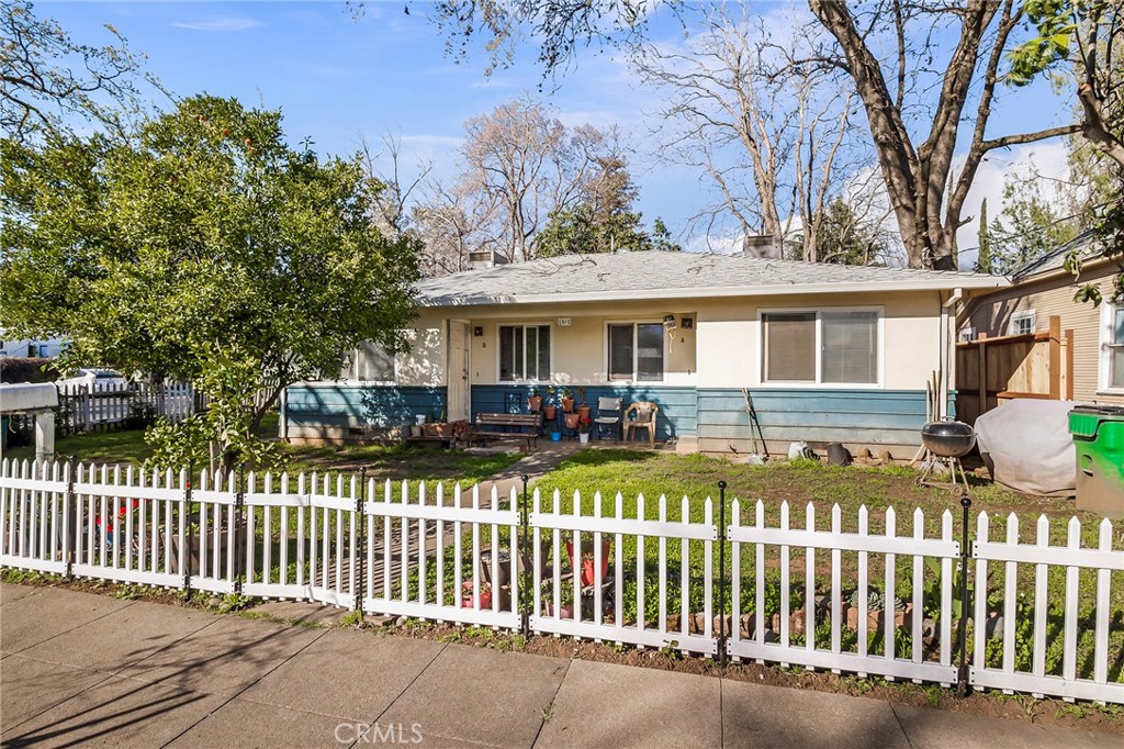 1317 Locust Street Chico, CA 95928 - Photo 1 of 1 a view of a house with wooden fence next to a house