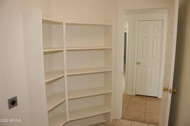 a view of an empty walk in closet