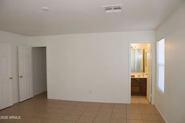 a view of an empty room and window