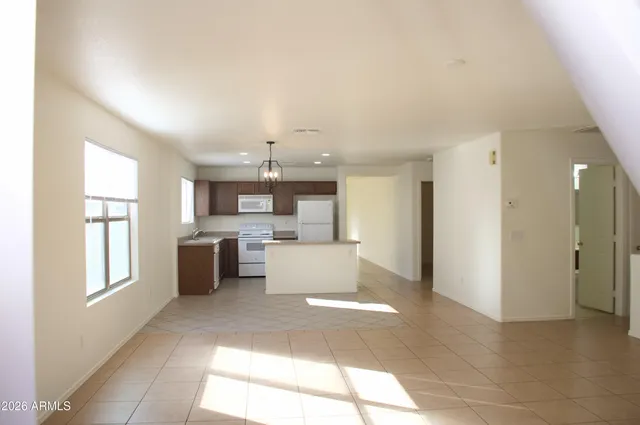 a view of a living room kitchen and a window