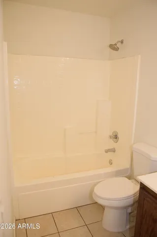 a bathroom with a toilet and a bathtub