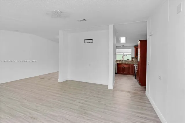 a view of a hardwood floor in hallway