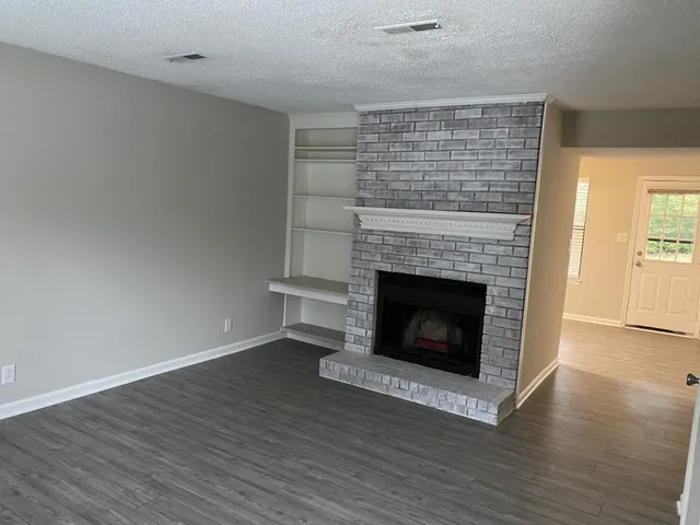a living room with a fireplace