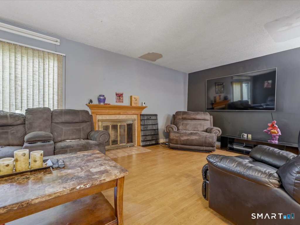 246 Reeds Gap Road, Unit 5C North Branford, CT 06472 - Photo 8 of 27 Living room with fireplace