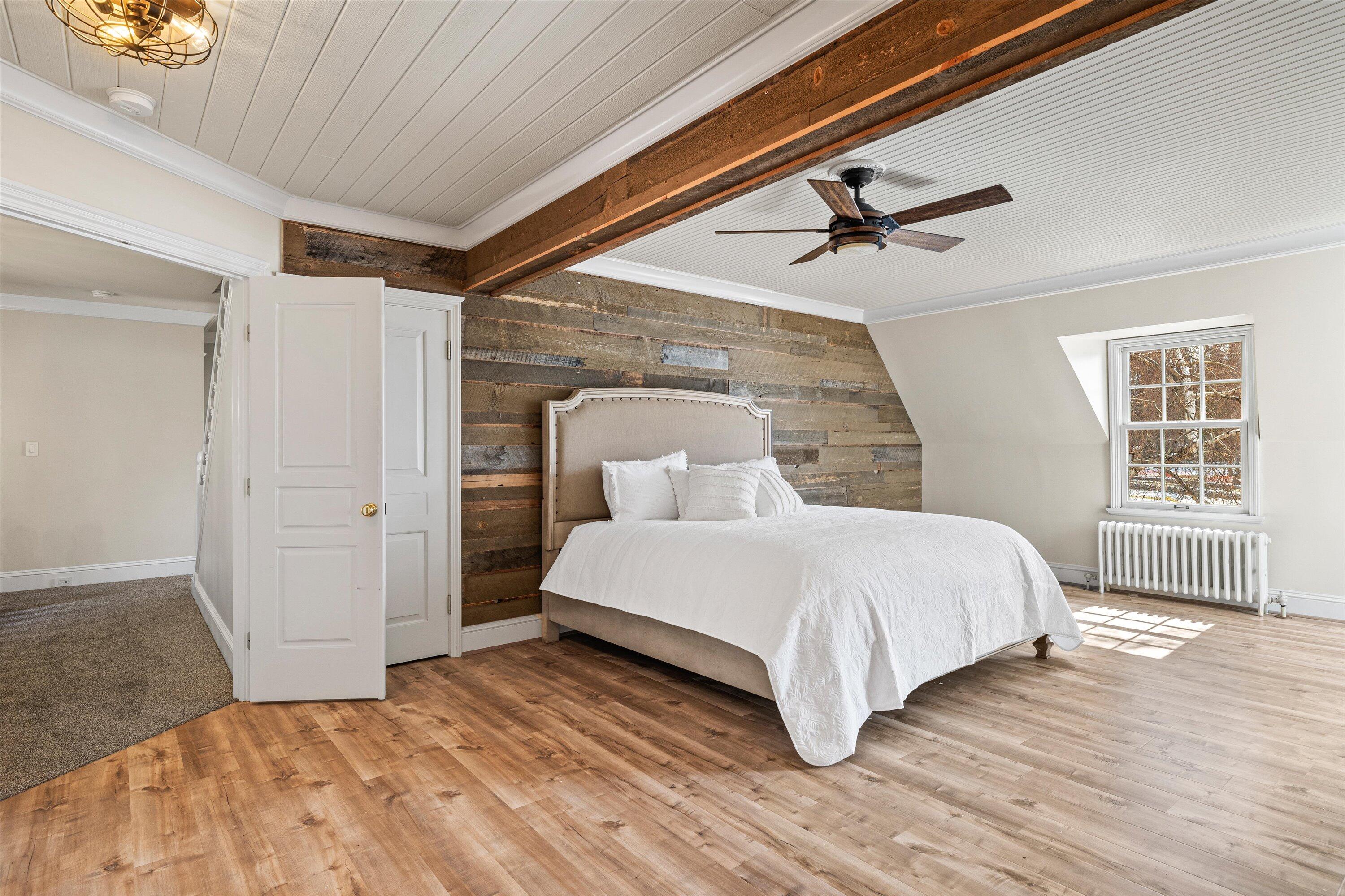 437 Northwest Drake Road Bend, OR 97703 - Photo 37 of 86 a bedroom with a bed and a window