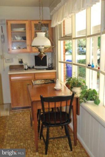13233 Clifton Road Silver Spring, MD 20904 - Photo 12 of 30 a dining room with furniture and a window