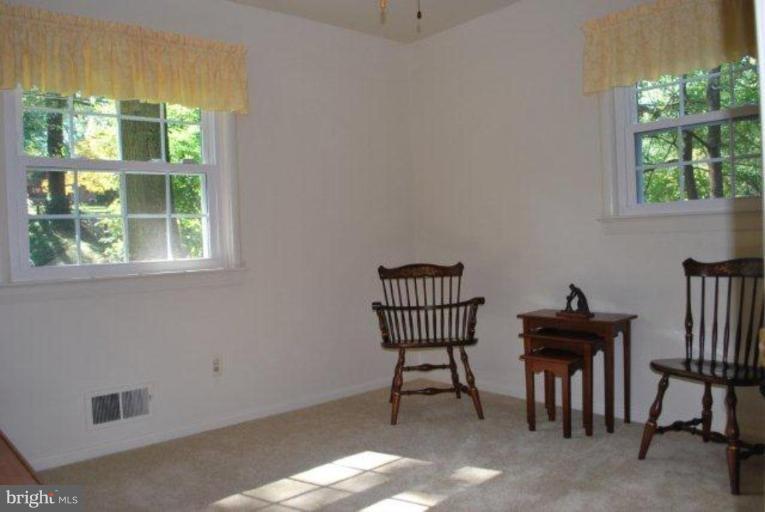 13233 Clifton Road Silver Spring, MD 20904 - Photo 16 of 30 a view of a workspace with furniture and a window