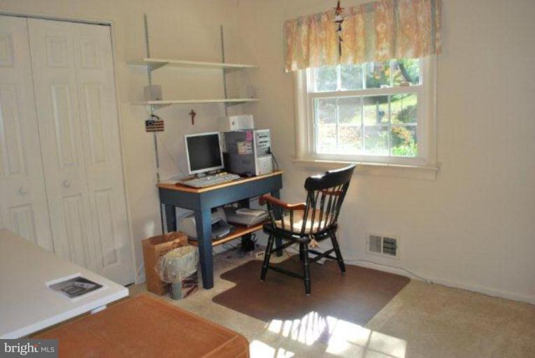 13233 Clifton Road Silver Spring, MD 20904 - Photo 17 of 30 a workspace with furniture and a window