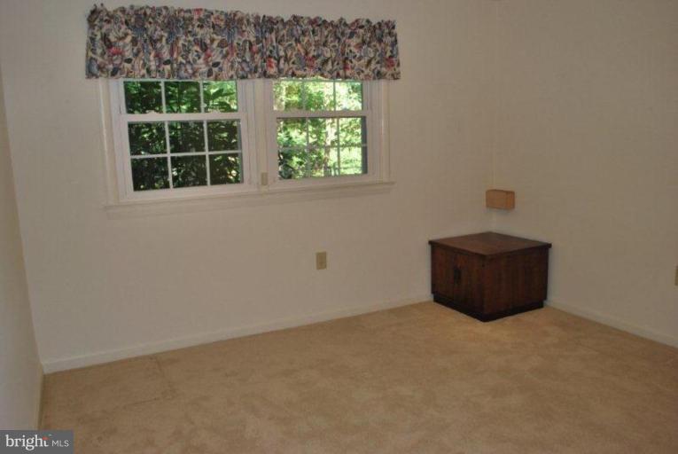 13233 Clifton Road Silver Spring, MD 20904 - Photo 18 of 30 an empty room with a window