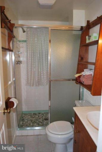 13233 Clifton Road Silver Spring, MD 20904 - Photo 21 of 30 a bathroom with a shower and a toilet