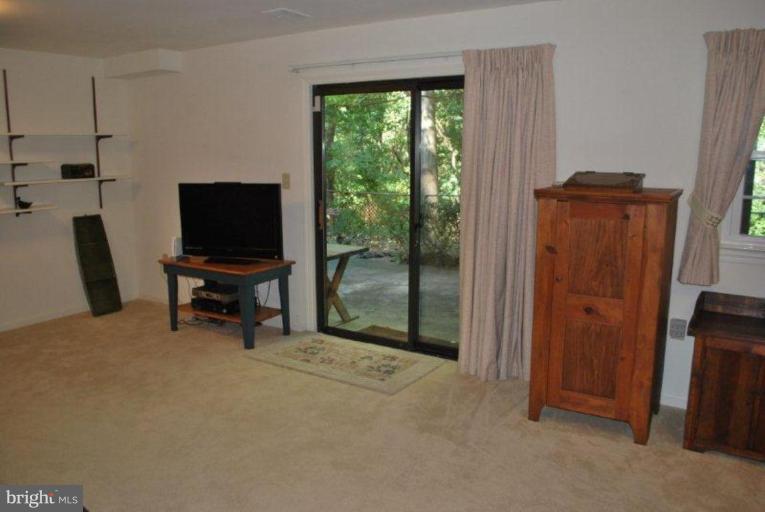 13233 Clifton Road Silver Spring, MD 20904 - Photo 24 of 30 a view of a workspace with furniture and a window