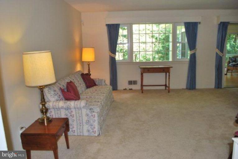 13233 Clifton Road Silver Spring, MD 20904 - Photo 6 of 30 a living room with furniture and a window