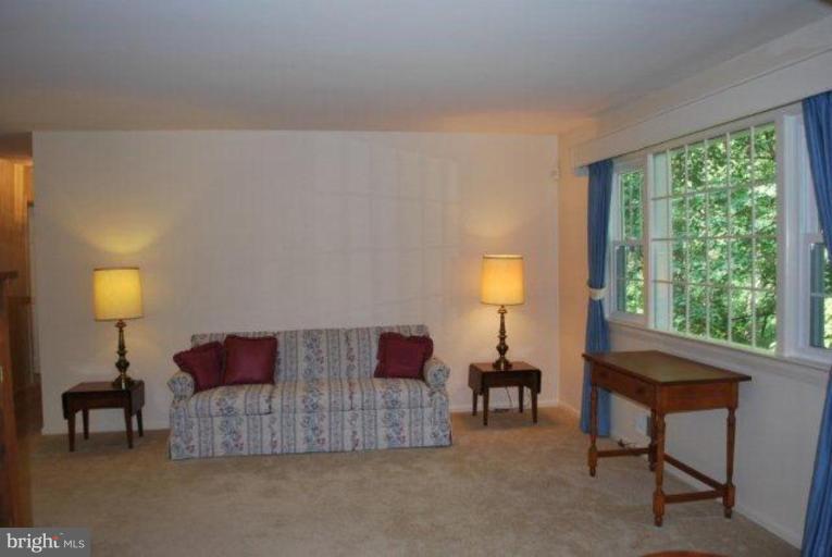 13233 Clifton Road Silver Spring, MD 20904 - Photo 7 of 30 a living room with furniture and a lamp