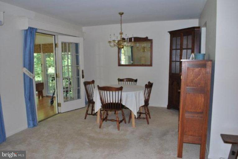 13233 Clifton Road Silver Spring, MD 20904 - Photo 8 of 30 a dining room with furniture and window