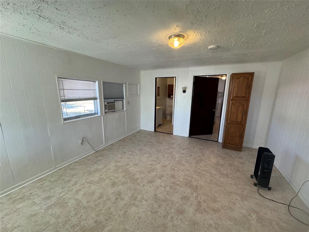 739 Iberis Road South, Unit 2 Abilene, TX 79606 - Photo 2 of 6 an empty room with windows and closet
