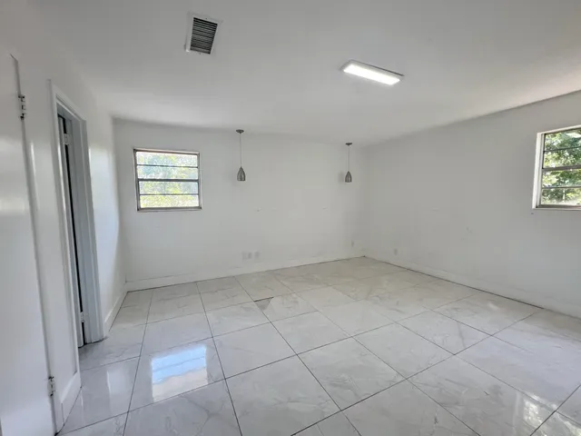 an empty room with windows