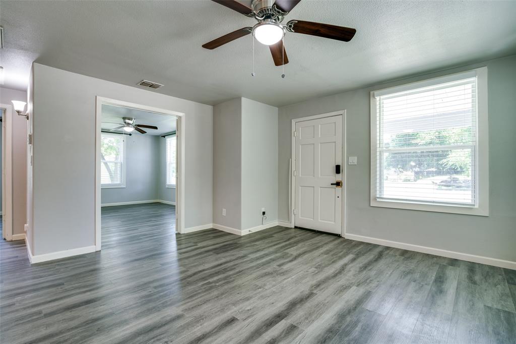 606 West High Street Terrell, TX 75160 - Photo 6 of 28 a view of an empty room with wooden floor and a window
