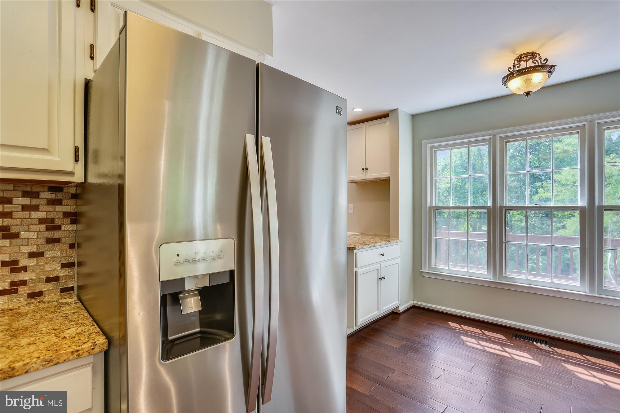 8908 Spring Berry Court Gaithersburg, MD 20886 - Photo 12 of 59 Kitchen has stainless steel appliances, backsplash